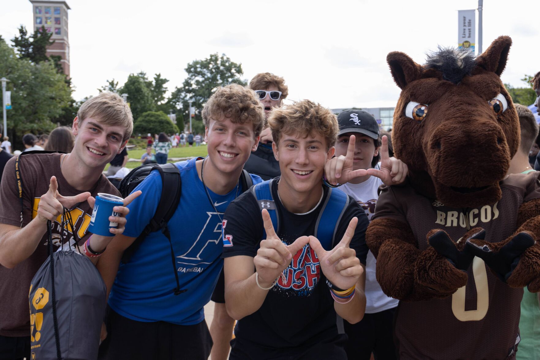 Students pose for a quick photo with Buster Bronco at Bronco Bash 2022.